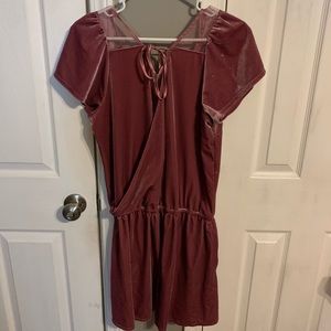 low cut purple-reddish romper.
